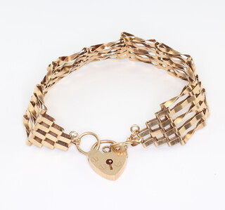 A 9ct gate bracelet with heart shaped locket, 11gms