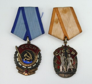 A Soviet Union medal The Order of The Badge of Honour no.1200985 and The Order of The Red Banner of Labour 829652 