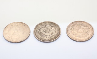 A China Republic memento dollar (Yuan) 1929, five pointed star 26.8 grams, a China He-Peh province 7 mace and 2 candareens and a Chinese provincial Yun-nan province 7 mace and 2 candareens
