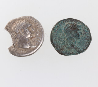 A Trajan bronze coin and a silver ditto 