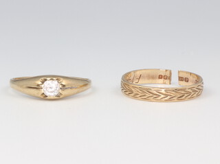 Two gentleman's yellow gold signet rings 1 with a brilliant cut diamond 0.02ct, 1 has a cut shank, 1.0 grams