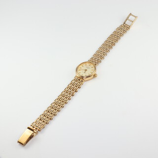 A lady's 9ct yellow gold Rotary quartz wristwatch on a 9ct bracelet, gross weight including movement and glass, 13.4gms