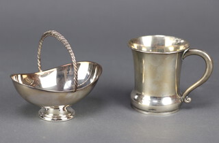 A sterling silver basket, 11cms and a silver mug, 8cm 156gms