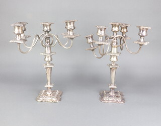 A pair of plated 5 light candelabra with repousse decoration, 41cm
