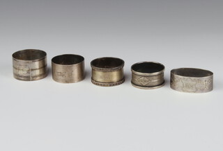 A silver napkin ring Birmingham 1974, 4 others 126 grams