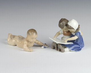 A Bing and Grondahl figure of 2 children reading a book no.1567 10cm, a ditto crawling baby 1739 15cm 