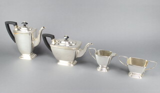 An Art Deco silver plated tea and coffee set comprising teapot, coffee pot, sugar bowl and milk jug with ebony mounts