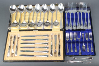 A quantity of ribbon and thread silver plated cutlery comprising 6 pairs of dessert eaters cased, 7 cake forks cased, 7 dinner forks, 8 soup spoons, 8 dessert spoons  