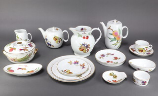 A service of Royal Worcester Evesham pattern dinnerware comprising 6 dinner plates, 9 side plates, 10 small plates, a teapot, a coffee pot, 11 tea cups, 11 saucers, a milk jug, sugar bowl, 10 dessert bowls, 10 ramekins, flan dishes, 3 small dishes, 4 small bowls, 4 avocado dishes, a sauce boat and stand, 5 soup bowls, a large jug, a casserole and cover,1 pie dish, a souffle dish (a/f), 3 tureens and covers (1 a/f), 4 oval vegetable dishes and a deep bowl