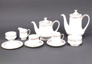 A Paragon Belinda pattern tea and coffee service comprising 1 teapot, 1 coffee pot, 17 coffee cups, 12 teacups, 34 saucers, 19 small plates, a sugar bowl, a milk jug, a large sugar bowl