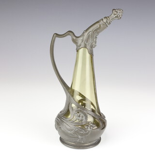 An Art Nouveau green glass ewer with pewter mounts, decorated with flowers and scrolls, 23cm 