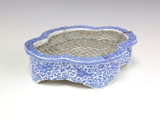 A Chinese quatre foil transfer print shallow bowl decorated with scrolling flowers, 32cm 