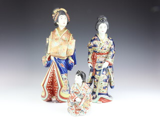 A Japanese porcelain figure of a Geisha, 39cm, a ditto 36cm (stuck head) and a smaller kneeling ditto 18cm (stuck)