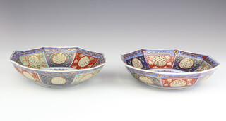A pair of Chinese octagonal porcelain bowls with reticulated decoration, 1 bearing an 18th Century character mark, decorated with flowers, 19cm