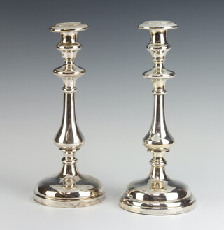 A pair of white metal baluster candlesticks 27cm 