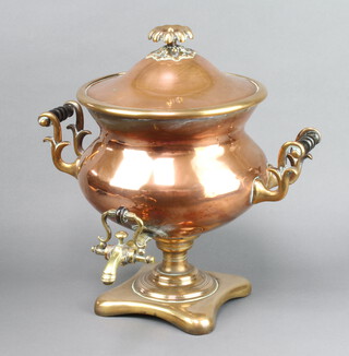 A Georgian copper and brass twin handled tea urn 40cm h x 39cm diam