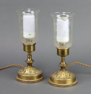 A pair of Rococo style gilt metal table lamps with etched glass shades and candle glow bulbs 27cm h x 10cm w