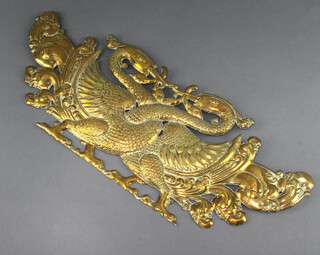 An Eastern embossed brass plaque decorated with two birds 17cm h x 43cm w