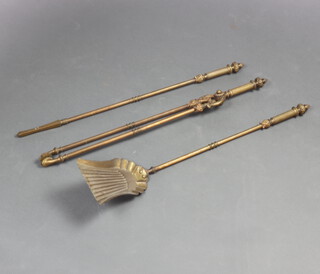A brass 3 piece fireside companion set with poker, tongs and shovel 