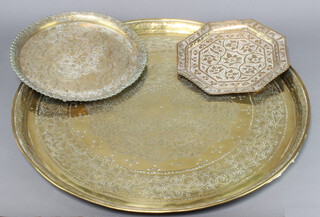 A polished Benares brass tray 24cm w x 23cm, two circular ditto 29cm diam and 58cm diam