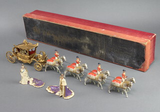 A Britains no 1470 George VI Coronation coach together with two standing figures of George VI and Queen Elizabeth (boxed)