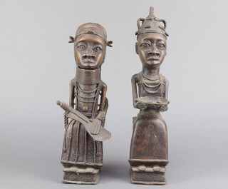 A pair of Benin bronze figures of seated ladies 35cm h x 7cm w x 9cm d 
