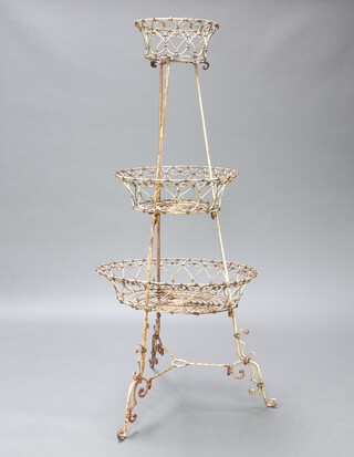 A Victorian style circular 3 tier graduated wire planter, raised on turned supports 152cm h x 63cm diam. 