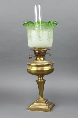 A gilt metal oil lamp with chimney and etched green glass shade 60cm h x 21cm 