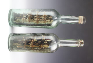 Two 19th/20th Century models of ships in bottles 29cm x 7cm 