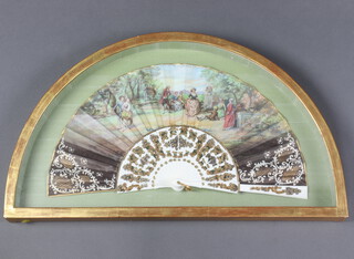 An early 20th Century fan with figures in a country garden, signed M Diago, framed 60cm