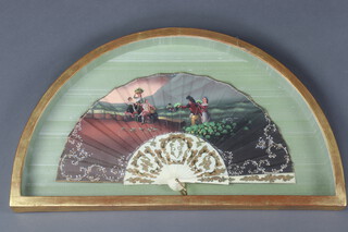 An early 20th Century Spanish painted fan decorated with crop gatherers at dusk, signed La Vendimia/M. Panells, 60cm 