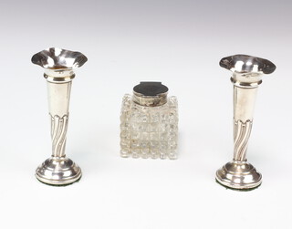 An Edwardian cut glass silver mounted inkwell, Birmingham 1905, 52.5cm, a pair of spill vases, marks rubbed, Birmingham 1920