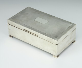 An Art Deco rectangular silver engine turned cigarette box on ogee bracket feet Birmingham 1937, 16cm x 9cm  