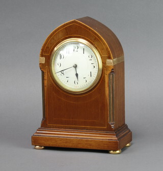 A French bedroom timepiece with enamelled dial and Arabic numerals contained in an inlaid mahogany lancet shaped case 23cm h x 17cm w x 8cm d 