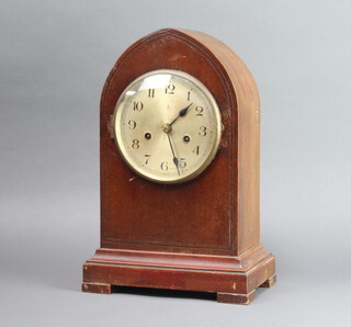 Gustav Becker, a striking mantel clock with 14cm silvered dial and Roman numerals contained in a mahogany lancet shaped case, with pendulum but no key 38cm h x 24cm w x 16cm d 