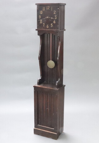 An Arts & Crafts style striking longcase clock, the 33cm rectangular dial with gilt Arabic numerals contained in a panelled oak case 181cm h x 38cm w x 25cm d, complete with pendulum but no key  