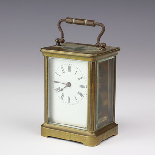 A 19th Century carriage timepiece with enamelled dial and Roman numerals, contained in a gilt metal case 10cm x 8cm w x 6cm d (no key)