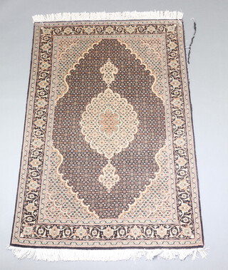 A black and white ground North West Persian silk rug with central medallion 155cm x 103cm 