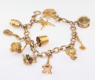 A 9ct yellow gold charm bracelet, gross weight 26.8gms