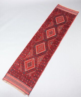 A red and blue ground Meshwani runner with 4 diamonds to the centre 238cm x 61cm 