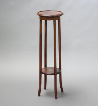 An Edwardian circular inlaid mahogany 2 tier jardiniere stand raised on outswept supports 99cm h x 31cm diam. 