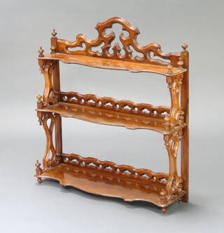 A Victorian carved and pierced walnut 3 tier hanging wall shelf with pierced gallery to the back 72cm h x 67cm w x 19cm d 