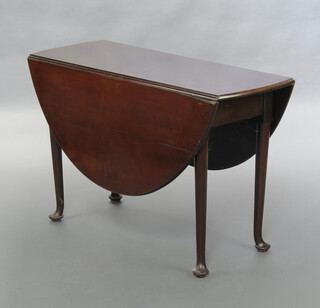 A Georgian mahogany oval drop flap dining table, raised on pad feet 70cm h x 110cm  w x 40cm when closed x 120cm when closed 