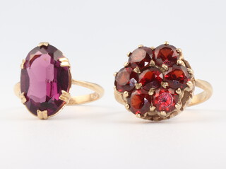 A 9ct yellow gold amethyst ring, size l 1/2 and a yellow metal cluster ring, size K, 9gms gross