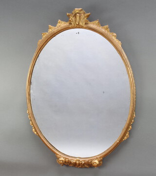 A Georgian style oval plate wall mirror contained in a gilt frame 87cm x 52cm 