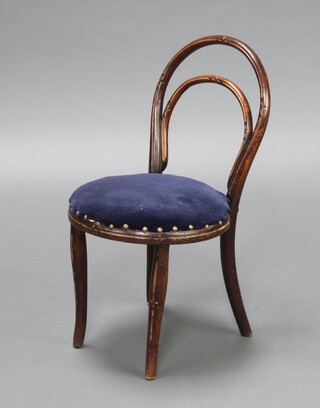 Thonet, a child's carved bentwood chair with upholstered seat raised on outswept supports 61cm h x 34cm 