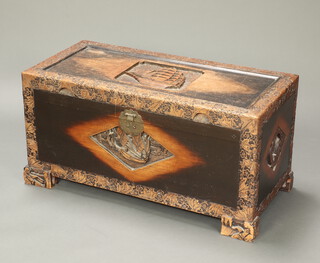 A carved Chinese camphor coffer with hinged lid decorated a sailing ship 47cm x 94cm x 45cm 