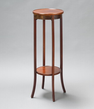 A circular mahogany 2 tier jardiniere stand raised on outswept supports 100cm h x 34cm diam. 