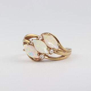 A 9ct yellow gold triple opal ring set with brilliant cut diamonds, size L, 3.7gms