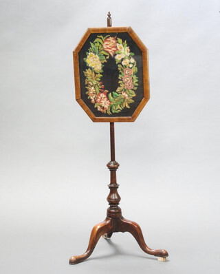 A Victorian pole screen with octagonal wool work banner raised on turned column and tripod base 113cm h x 34cm w